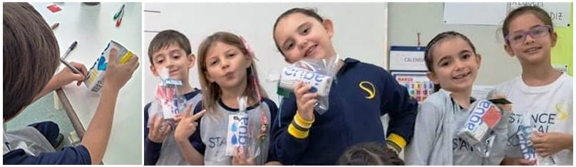 Alunos do 2º ano mostram os porta-escovas de dentes que fizeram com dicas para economizar água