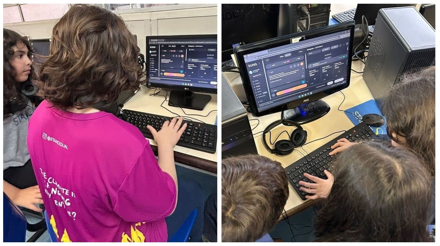 Alunos criam músicas em computadores usando um software de produção musical